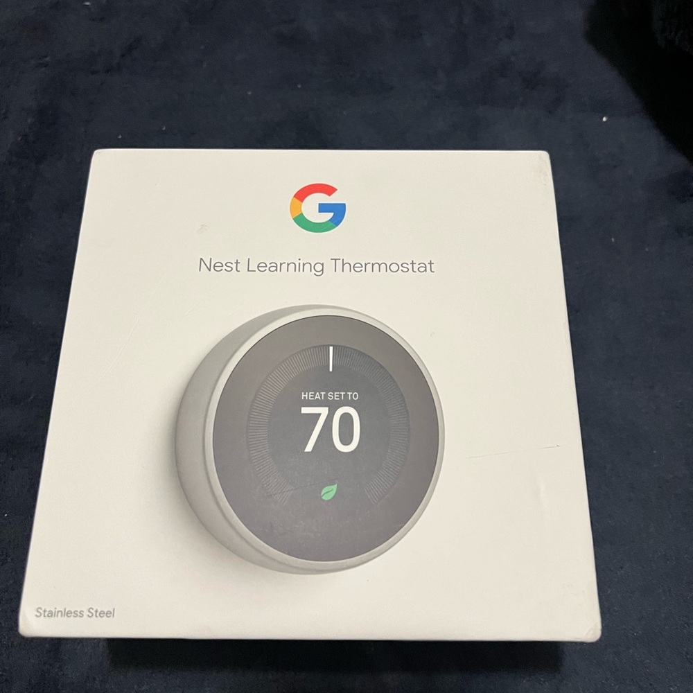 Google Nest Thermostat - Sleek Silver Design